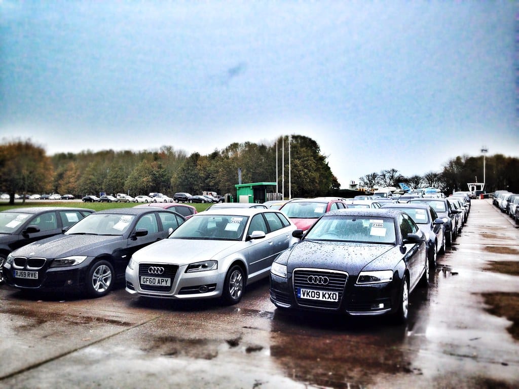 Rows of cars parked at a UK auction compound