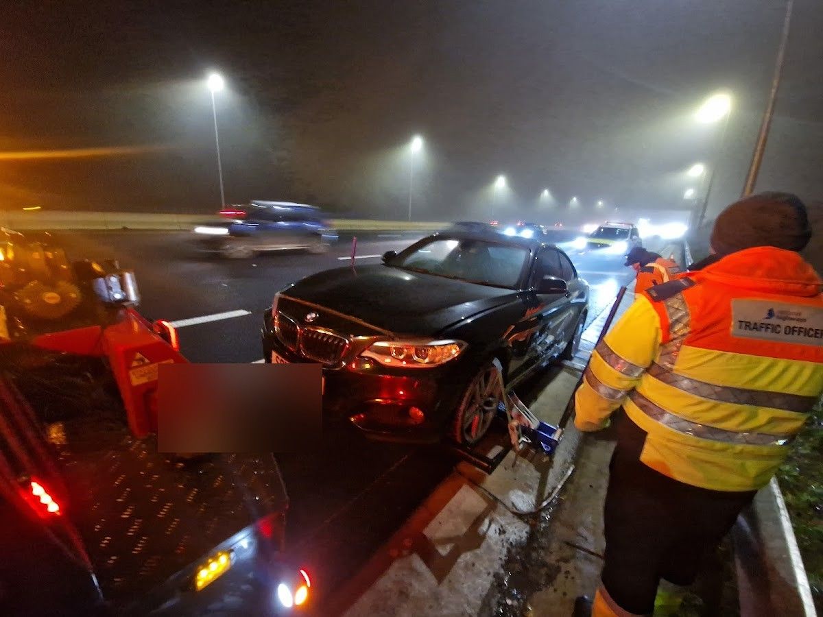 Recovery vehicle attending a car on a UK motorway